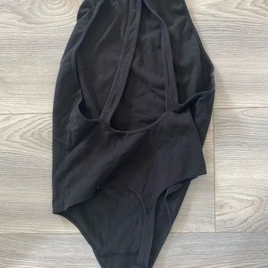Babaton low back criss cross, high neck bodysuit. Super cute! Size L